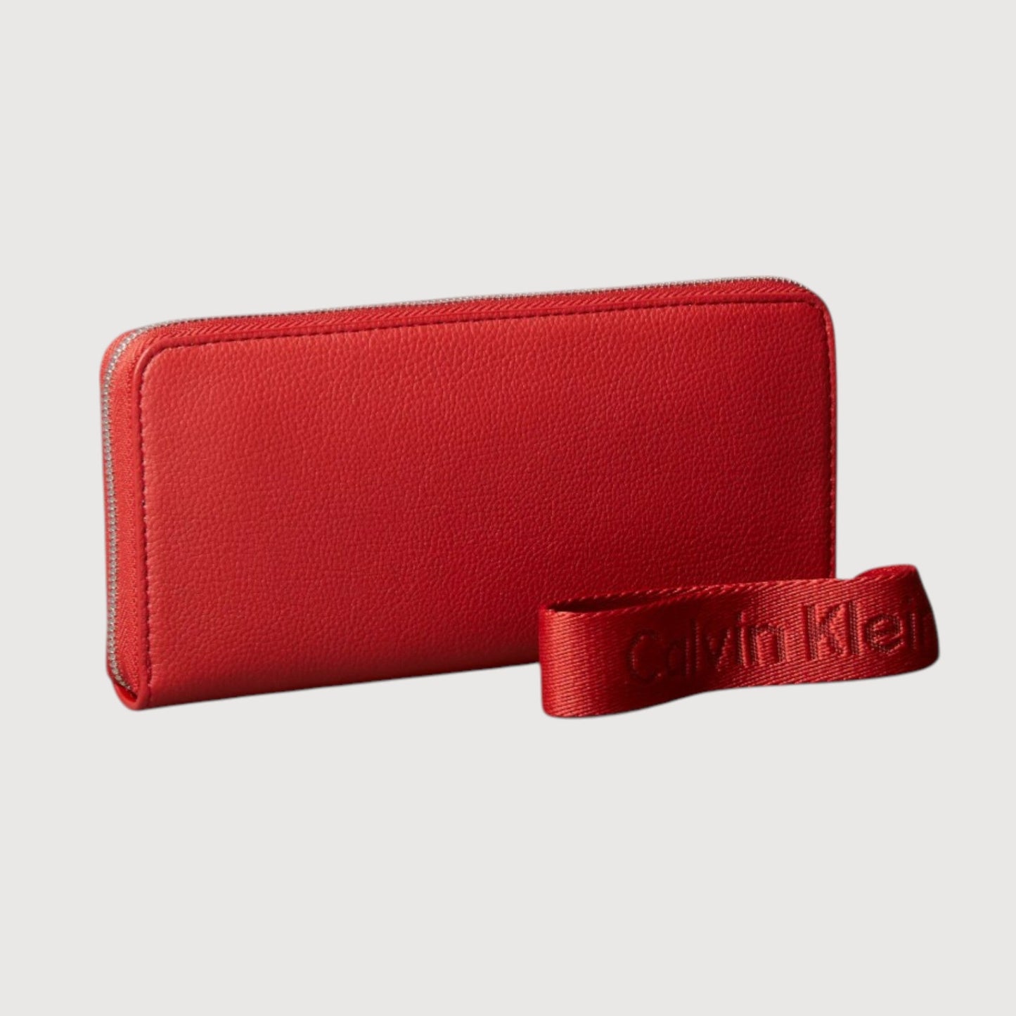 Cartera de muñeca con cremallera Calvin Klein color Cataratas de lava