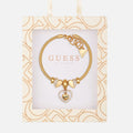 Pulsera con dije de corazón en tono dorado Guess